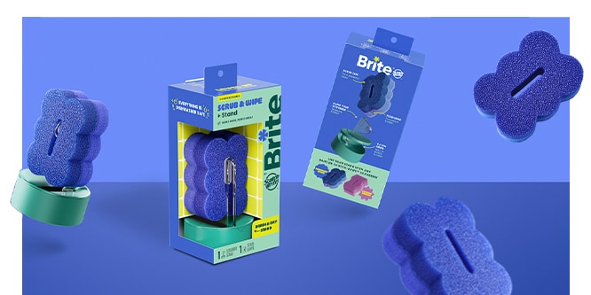 Packaging and components of a scalloped blue sponge & stand set against a blue background with floating sponge elements.
