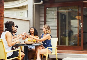 People eating at a table outdoors on a patio