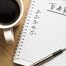 a to-do list and coffee